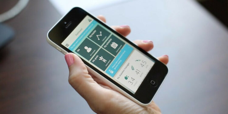 A hand with a smartphone with a medical app on the screen